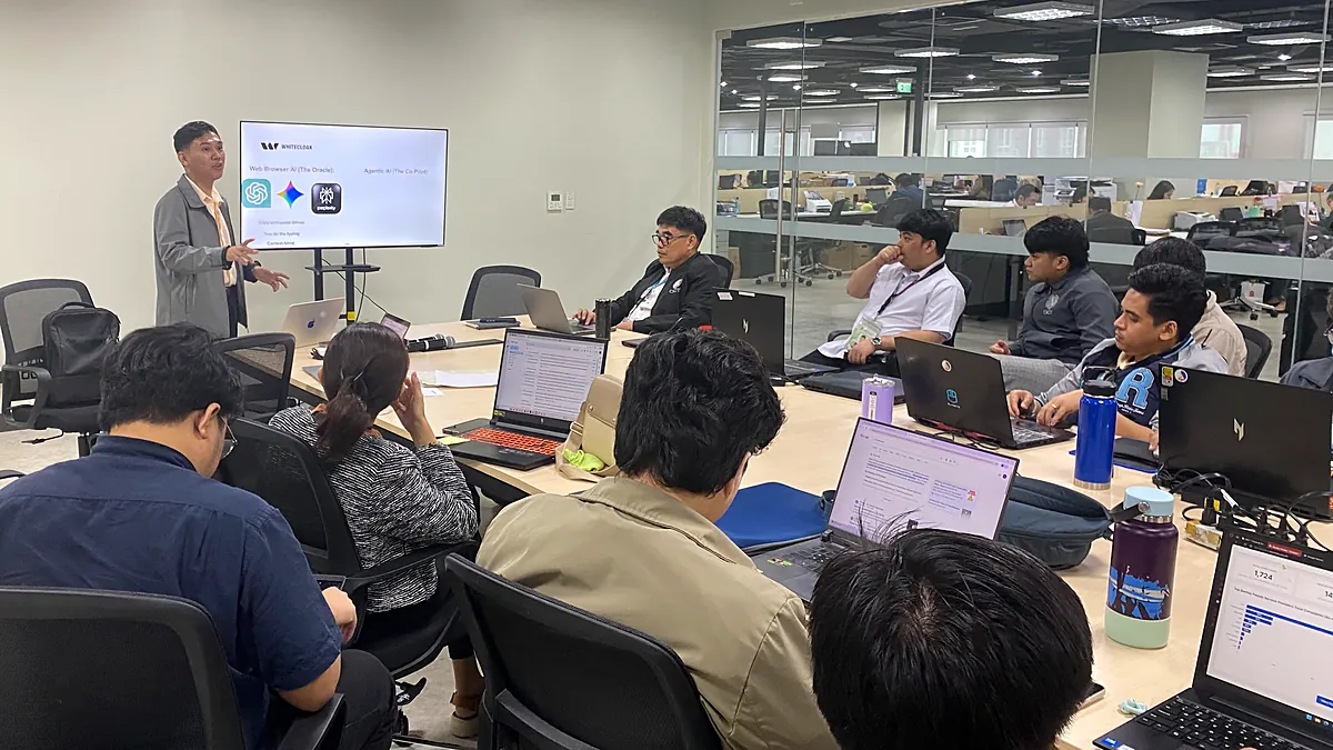 Anthony leading a Claude Code workshop for a room of engineers with laptops at White Cloak.